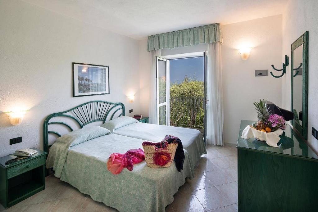 Postel nebo postele na pokoji v ubytování Hotel Terme Park Imperial
