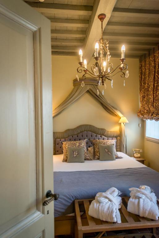 Postel nebo postele na pokoji v ubytování Hotel Jan Brito