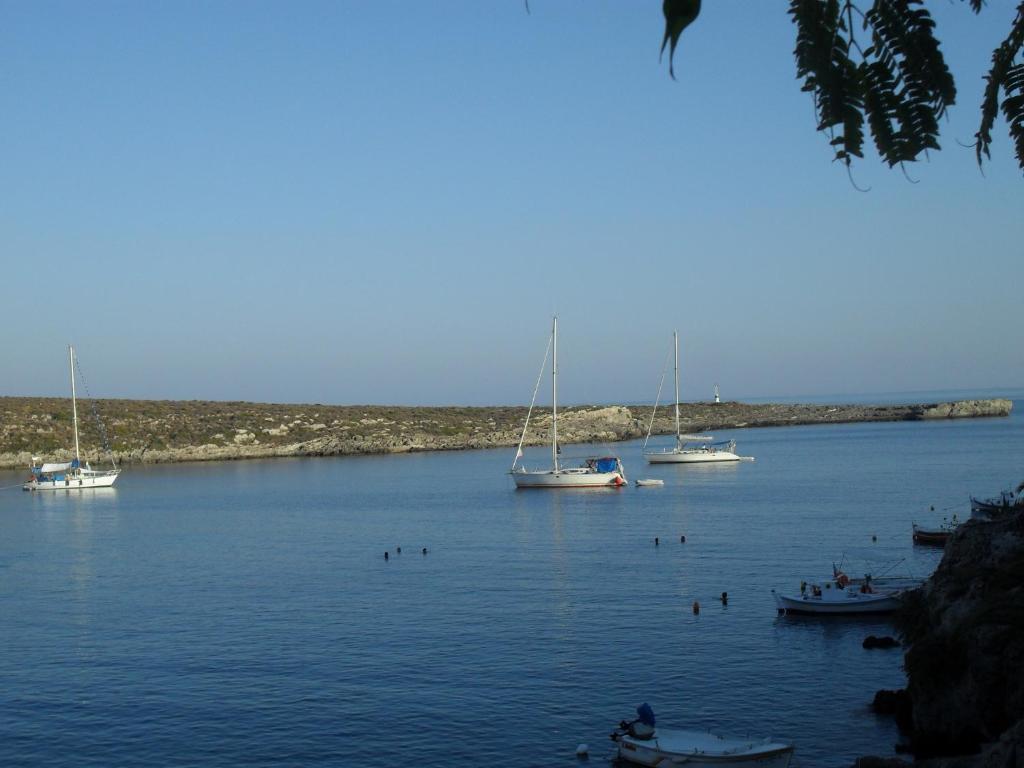a group of boats in a large body of water at Emmanouil in Kythira