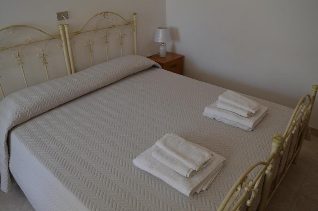 A bed or beds in a room at Casa Vacanze La Foggia