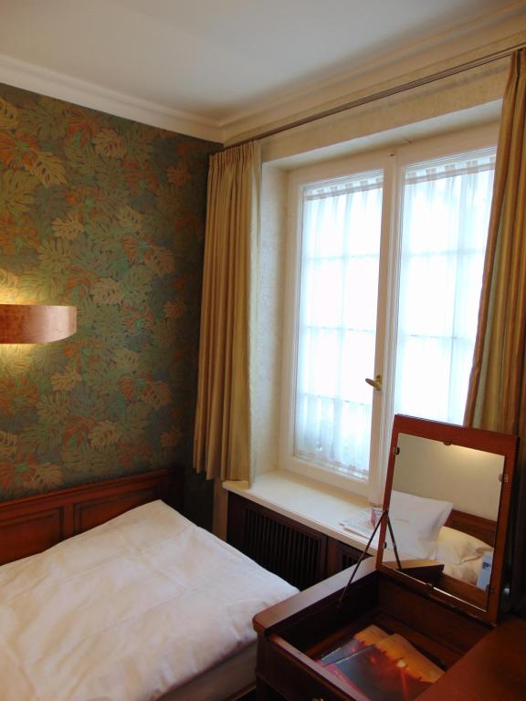 Postel nebo postele na pokoji v ubytování Boutiquehotel Oberkirch im Zentrum