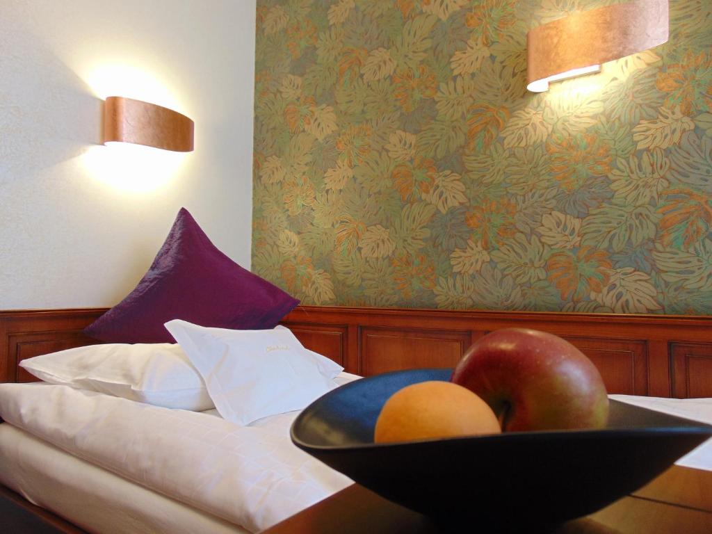 Postel nebo postele na pokoji v ubytování Boutiquehotel Oberkirch im Zentrum