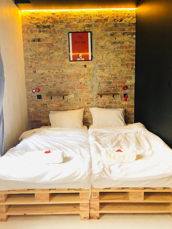 Postel nebo postele na pokoji v ubytování Retro Apartments