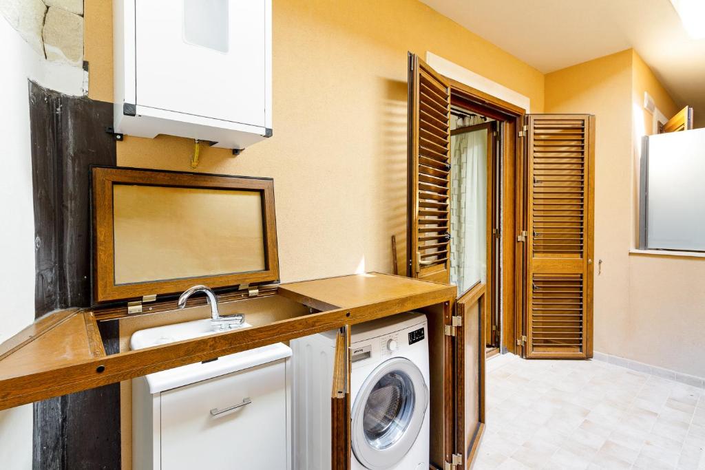 A kitchen or kitchenette at Calipso Seaview Flat with Private Parking