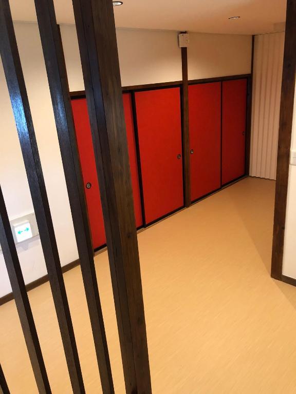 a room with red and red lockers at Oyado Zen in Kusatsu