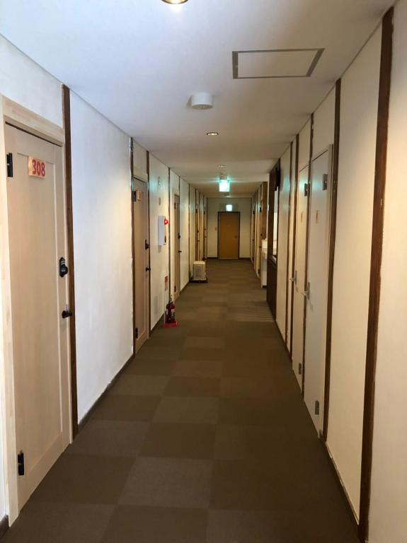 an empty hallway in an office building at Oyado Zen in Kusatsu