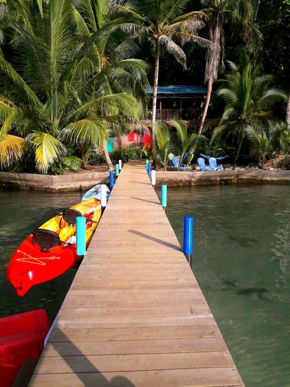 a dock with boats on a body of water at Carmen&#39;s place in Bastimentos