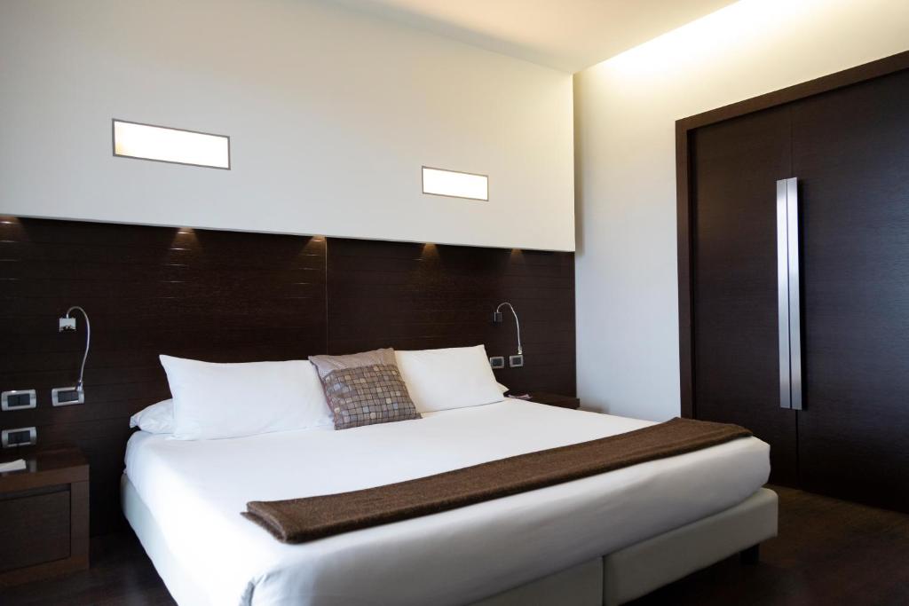 Postel nebo postele na pokoji v ubytování Hotel Selene Pomezia