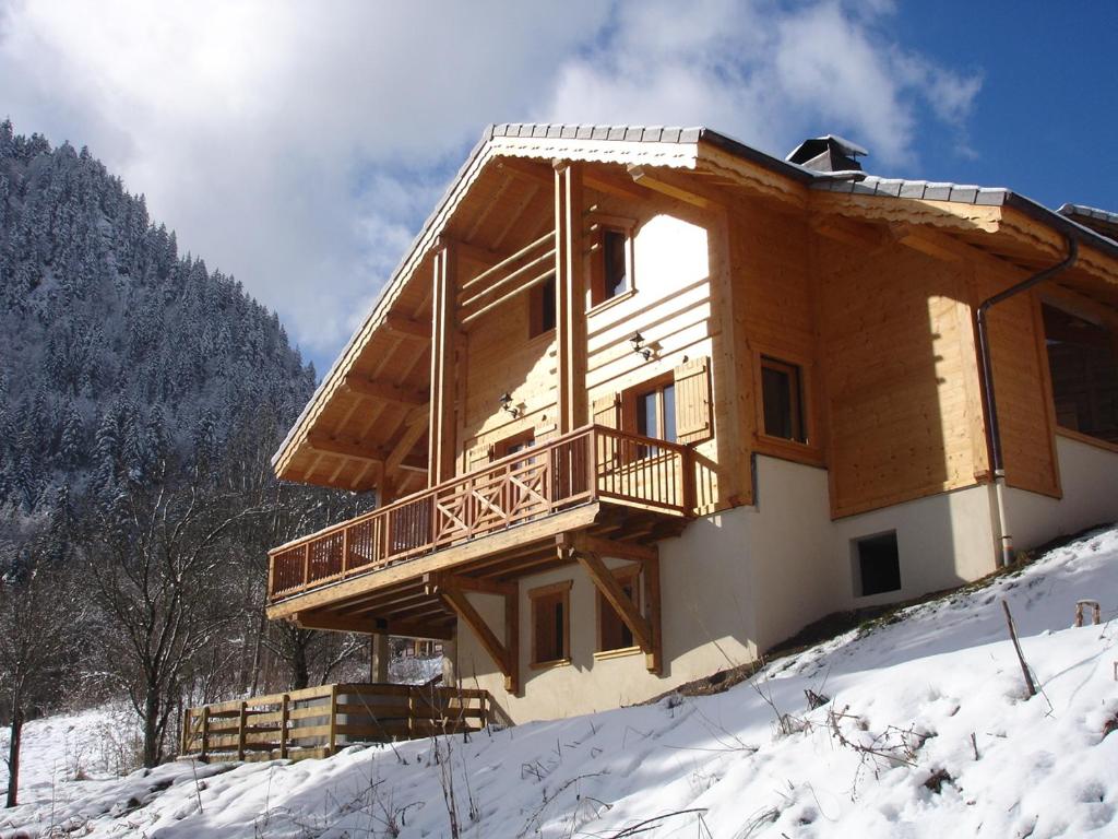 a house on top of a snow covered mountain at Chalet Etoile in Saint-Jean-d'Aulps