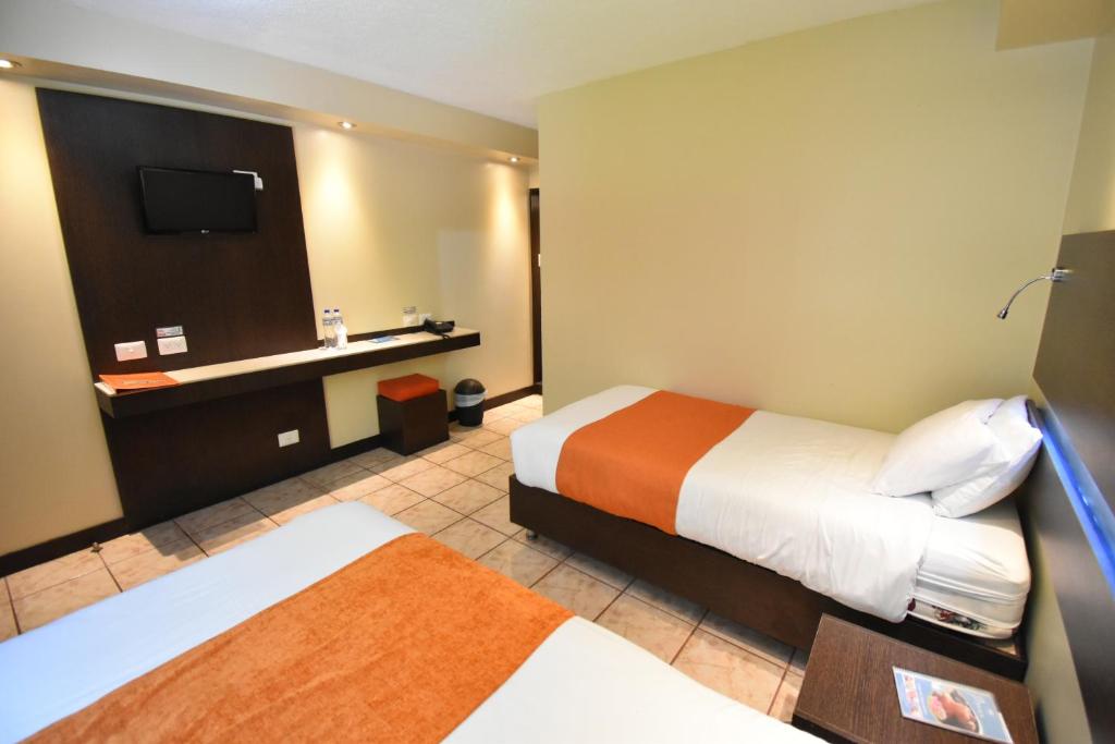 Postel nebo postele na pokoji v ubytování Monte Selva Hotel Spa Termal