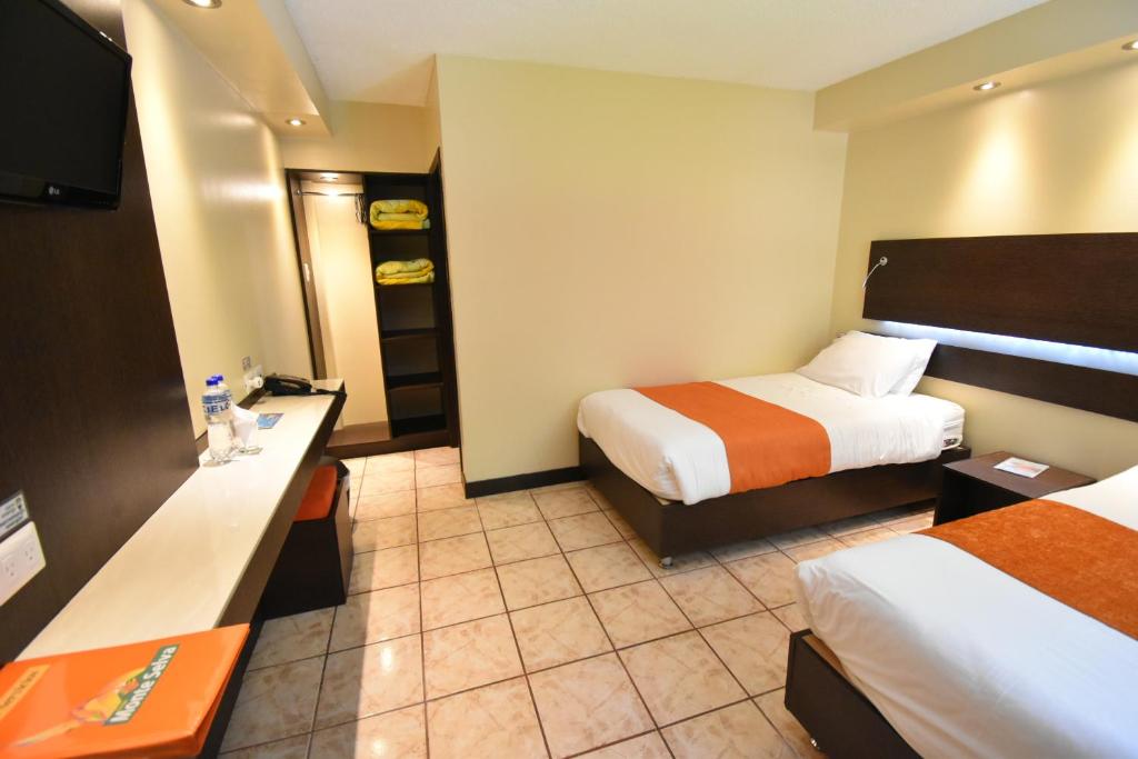 Postel nebo postele na pokoji v ubytování Monte Selva Hotel Spa Termal