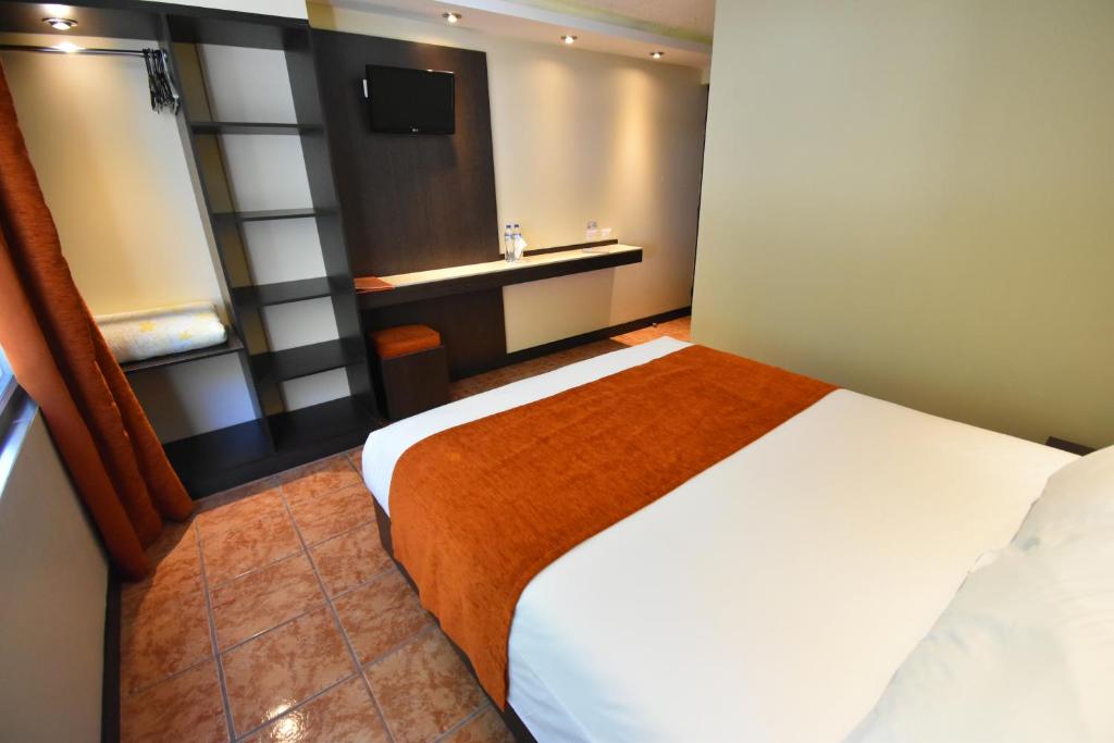 Postel nebo postele na pokoji v ubytování Monte Selva Hotel Spa Termal