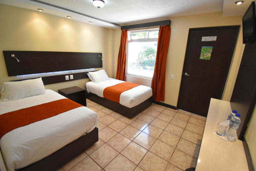 Postel nebo postele na pokoji v ubytování Monte Selva Hotel Spa Termal