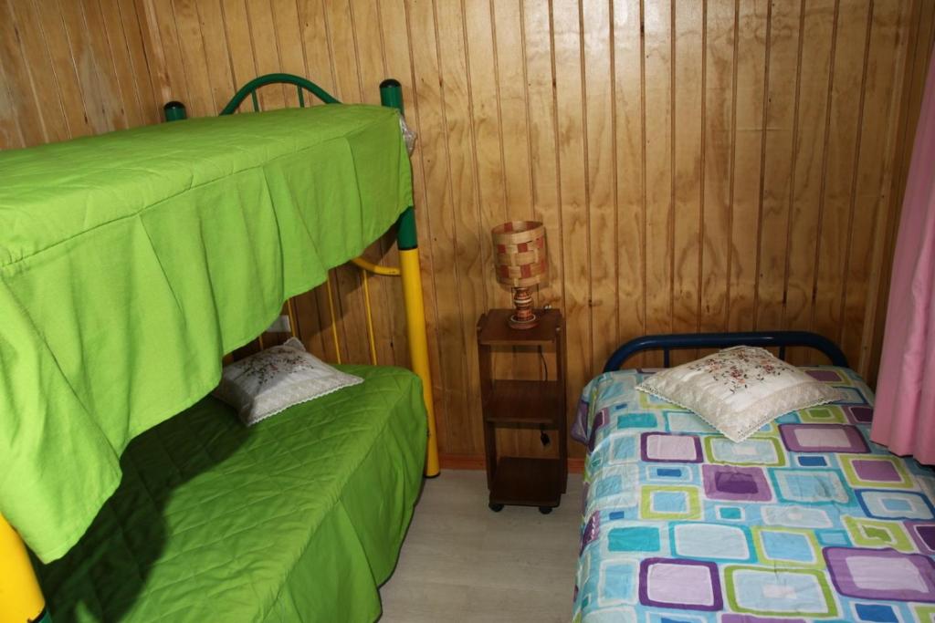 Postel nebo postele na pokoji v ubytování Laguna Verde Cabaña
