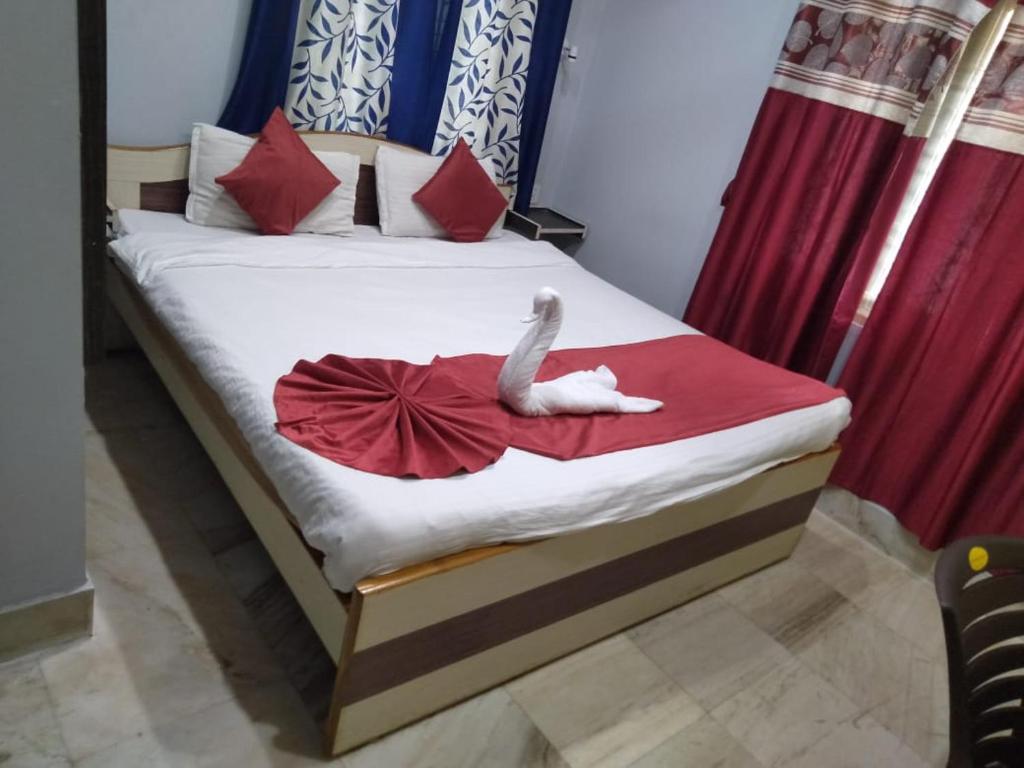 Postel nebo postele na pokoji v ubytování Ratna Resort near Bhubaneswar Airport
