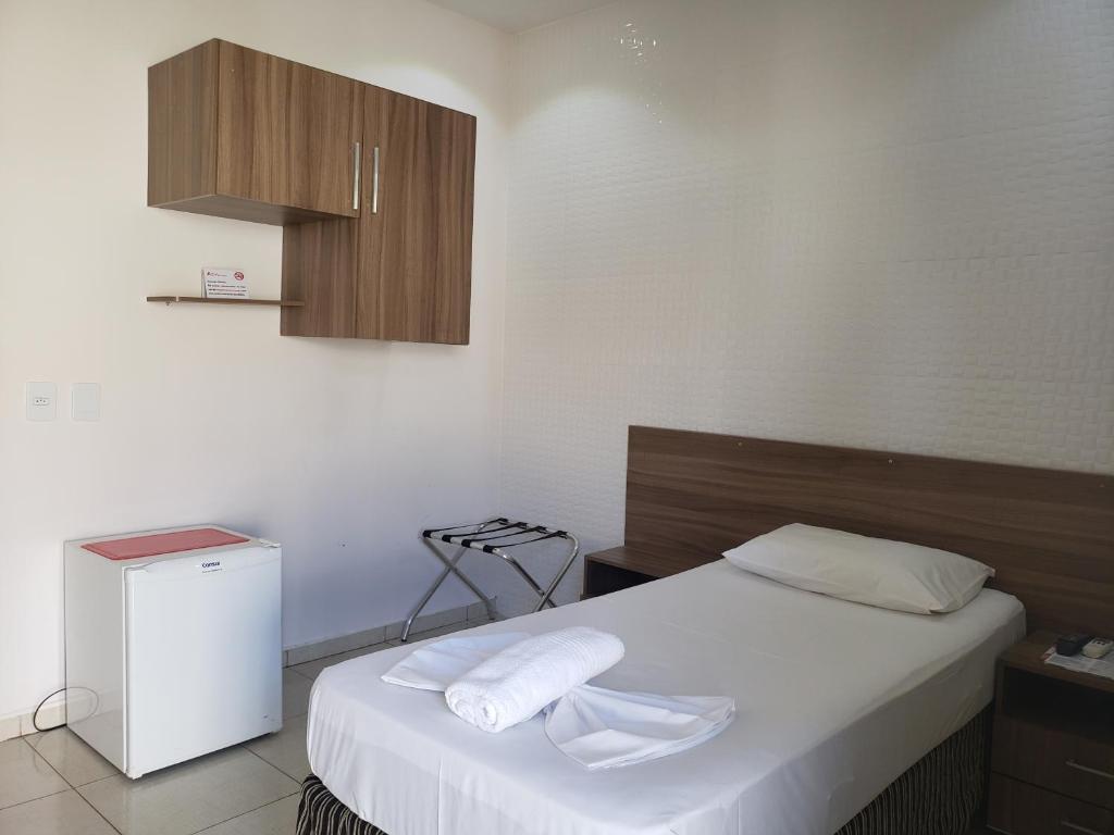 Uma cama ou camas num quarto em Hotel Astoria