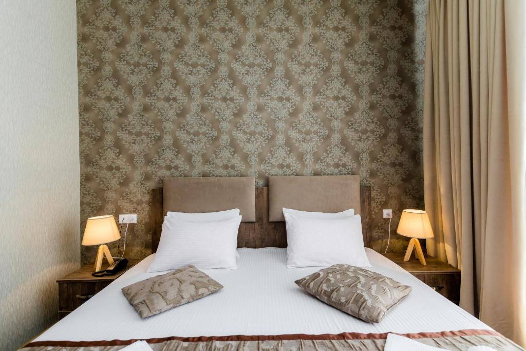 Postel nebo postele na pokoji v ubytování Hotel Makona