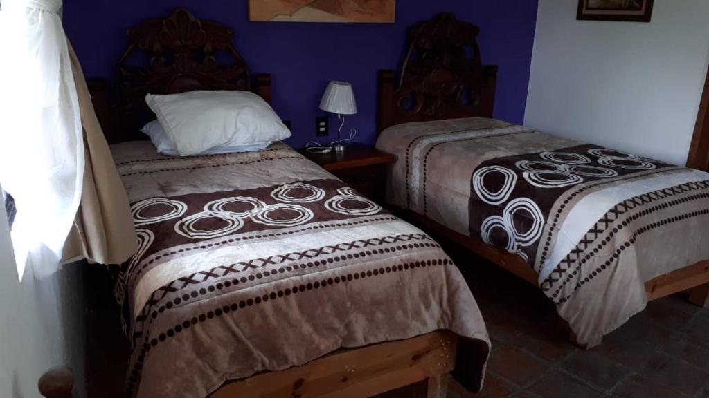 Postel nebo postele na pokoji v ubytování Hotel No Que No