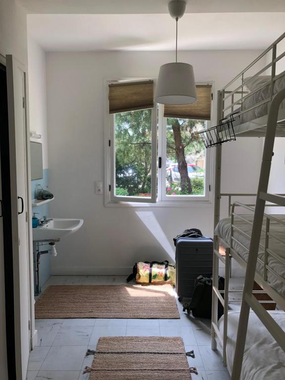 Postel nebo postele na pokoji v ubytování Surfhostel Hossegor