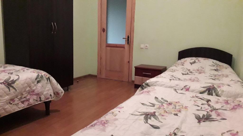 Postel nebo postele na pokoji v ubytování kobuleti bagrationi 40