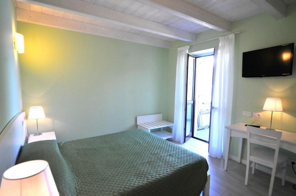 Postel nebo postele na pokoji v ubytování Villa Carolina