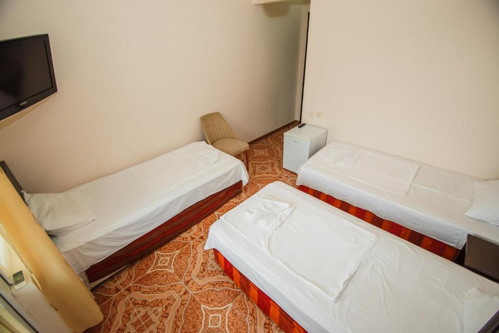 Postel nebo postele na pokoji v ubytování Guest House Nia