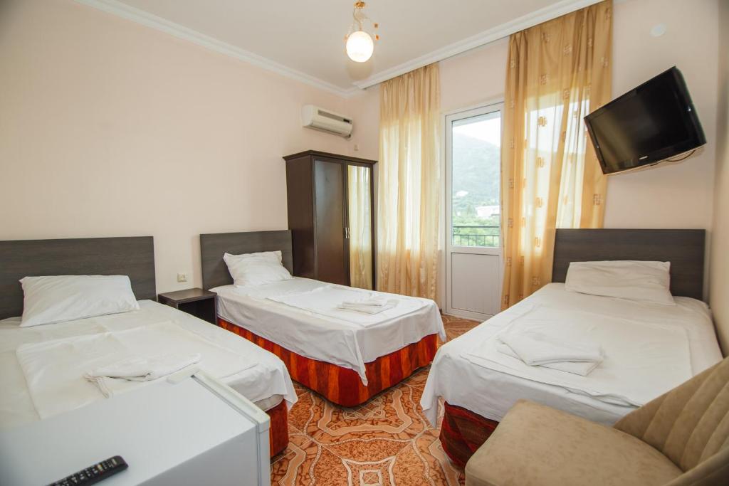 Postel nebo postele na pokoji v ubytování Guest House Nia