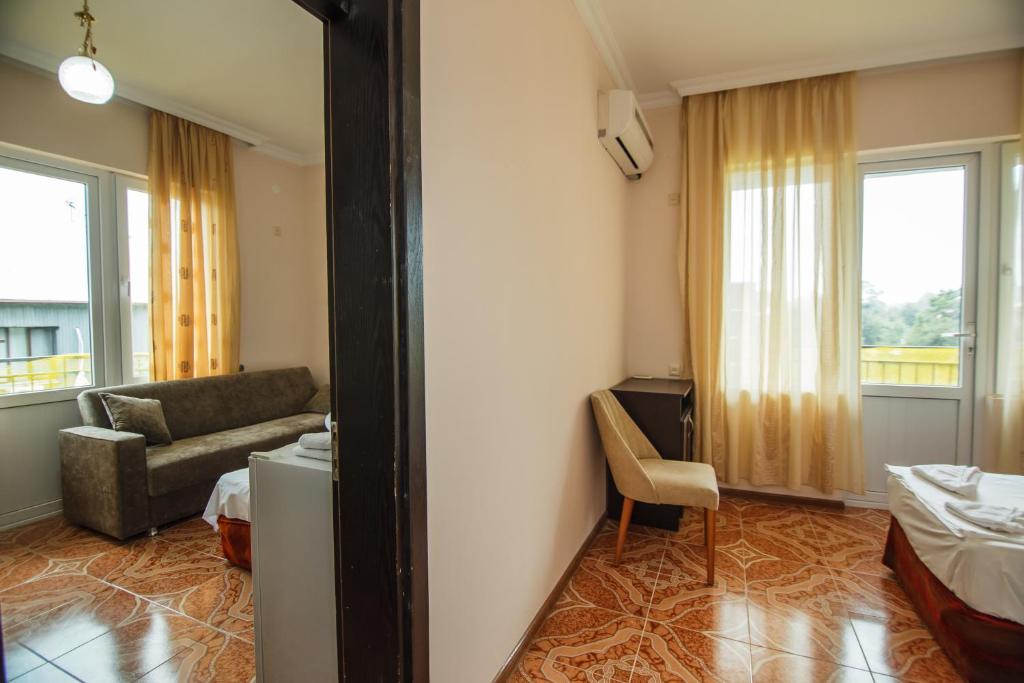 Postel nebo postele na pokoji v ubytování Guest House Nia
