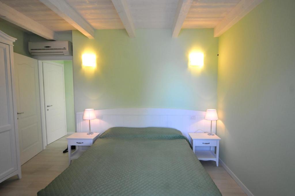 Postel nebo postele na pokoji v ubytování Villa Carolina