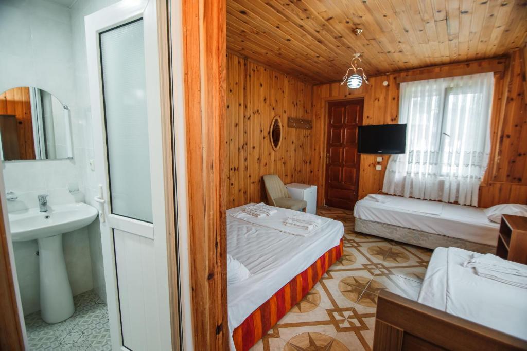 Postel nebo postele na pokoji v ubytování Guest House Nia