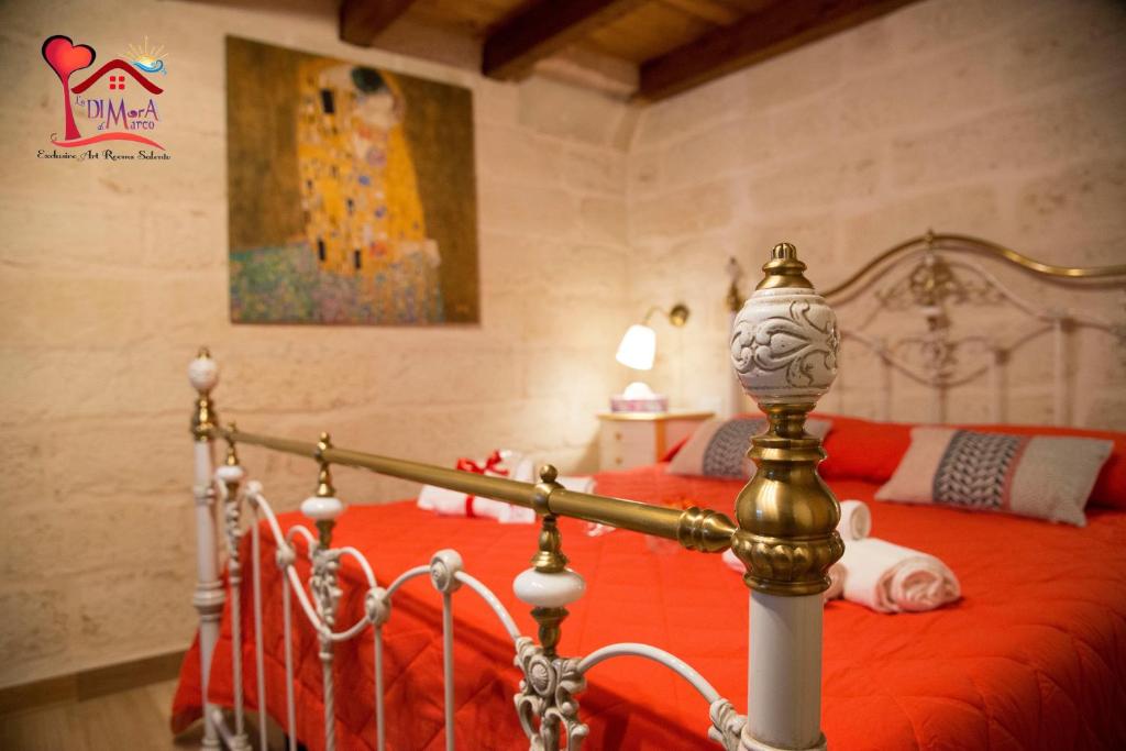 A bed or beds in a room at La DIMorA di Marco - Exclusive Art Rooms Salento