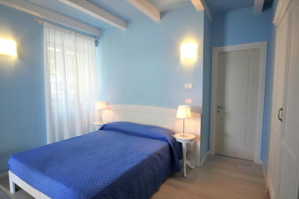 Postel nebo postele na pokoji v ubytování Villa Carolina
