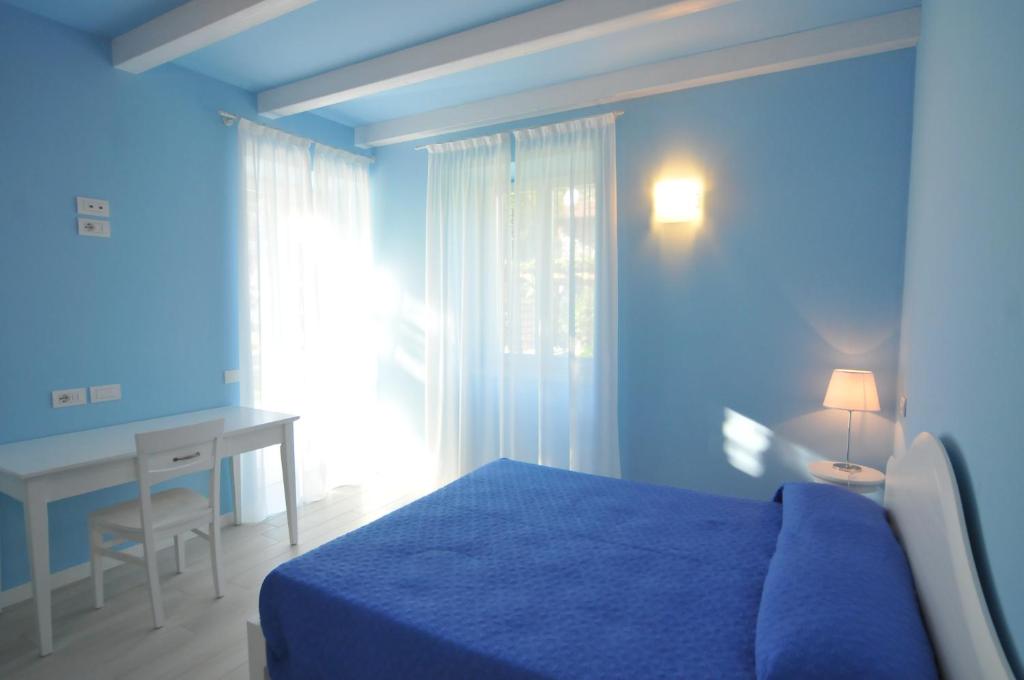 Postel nebo postele na pokoji v ubytování Villa Carolina
