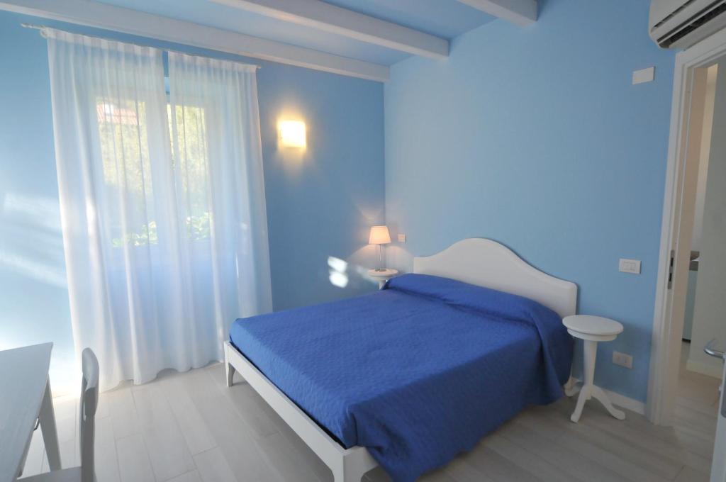 Postel nebo postele na pokoji v ubytování Villa Carolina