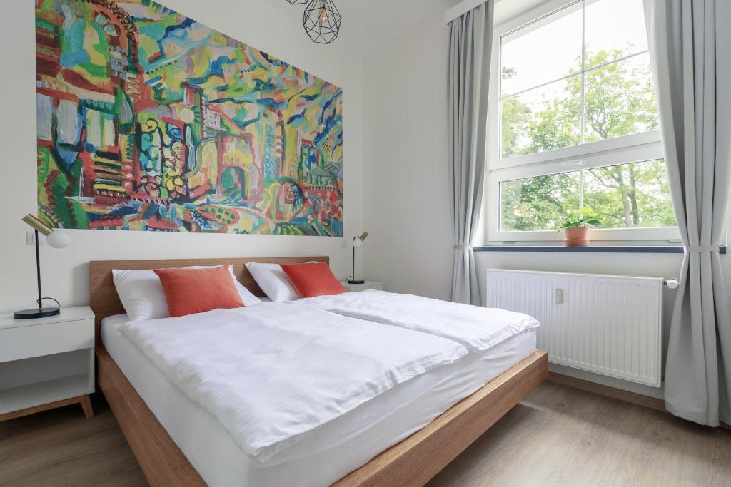 Postel nebo postele na pokoji v ubytování Avantgarde apartments