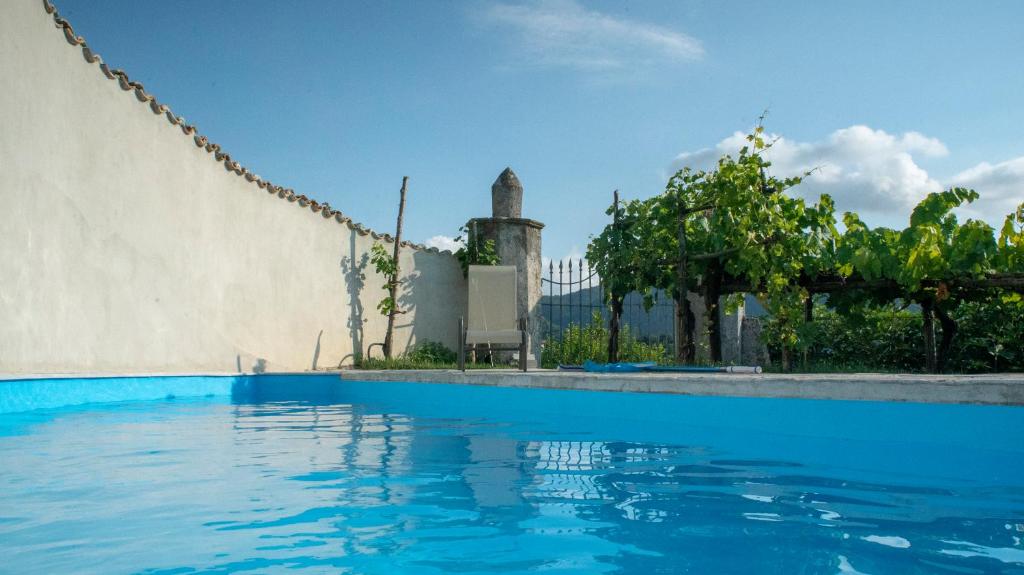 a swimming pool in front of a building at Il Casino di Donna Maria in Mormanno