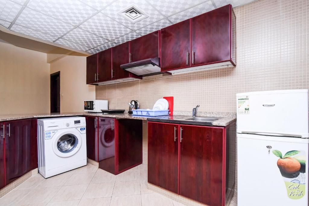 Kuchyň nebo kuchyňský kout v ubytování Paradise Inn 1 Tabasum Group