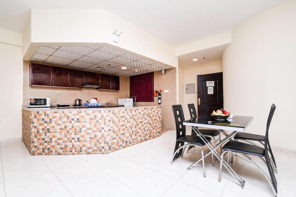 Kuchyň nebo kuchyňský kout v ubytování Paradise Inn 1 Tabasum Group