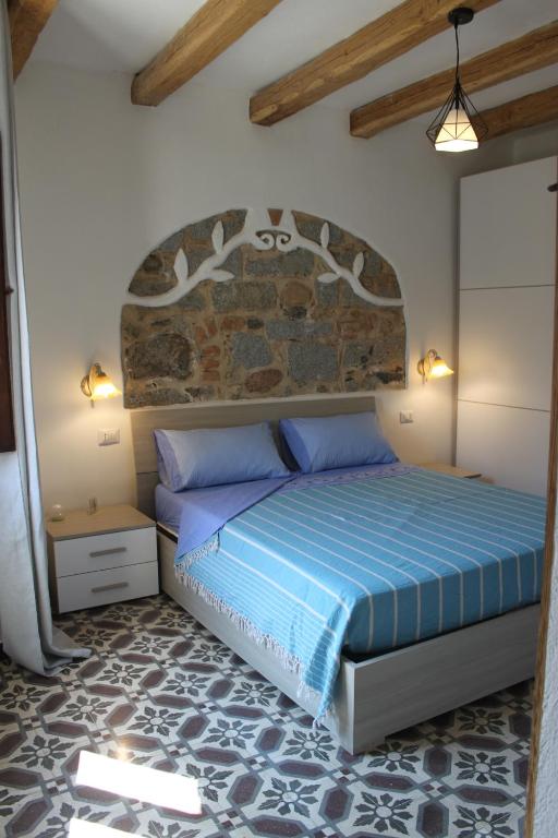 Ένα ή περισσότερα κρεβάτια σε δωμάτιο στο B&B Sotto Le Stelle vacanze