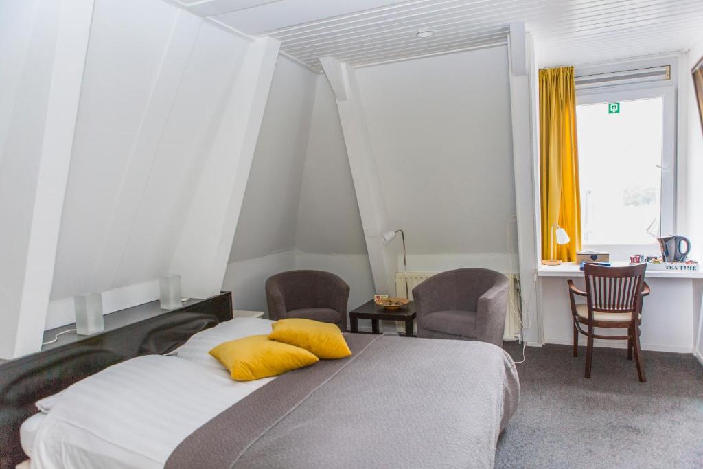 Postel nebo postele na pokoji v ubytování Hotel Jans