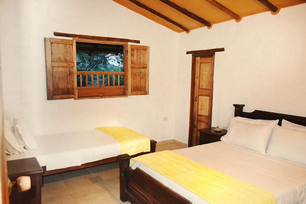 Postel nebo postele na pokoji v ubytování Posada Villa Paula