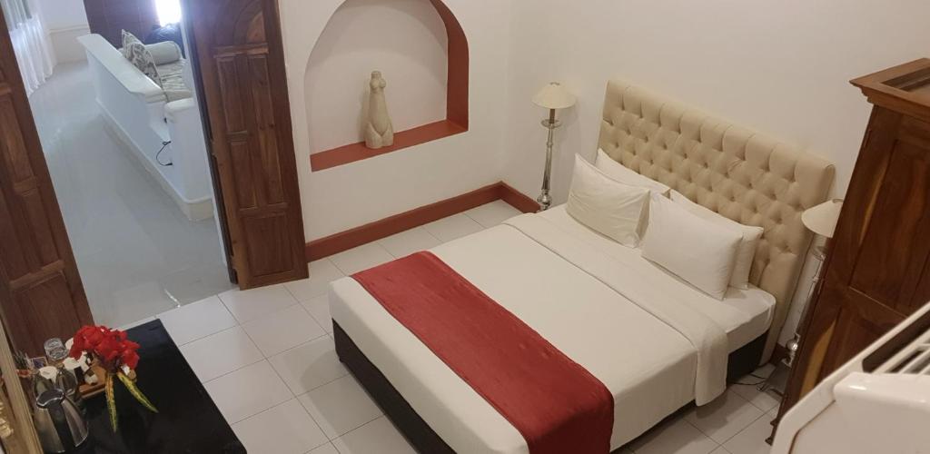 Postel nebo postele na pokoji v ubytování Ella Planters Bungalow