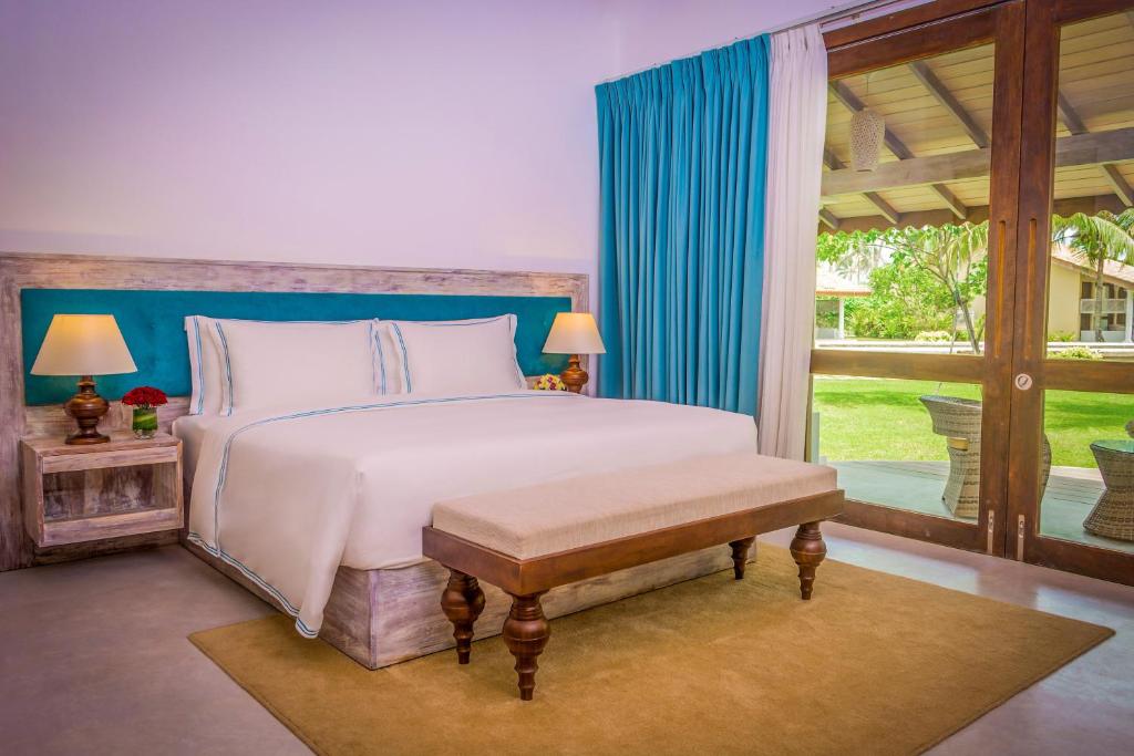 Postel nebo postele na pokoji v ubytování The Villas, Wadduwa