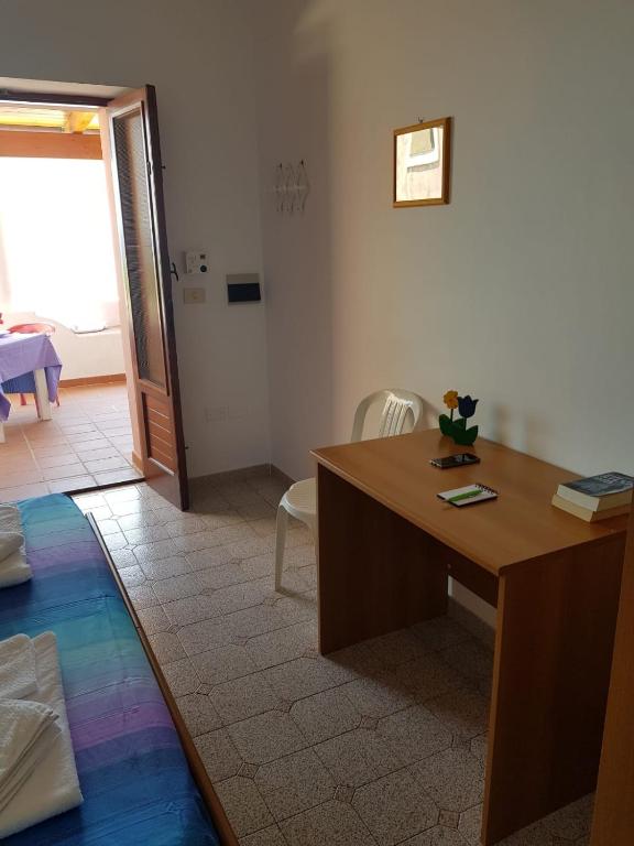 Łóżko lub łóżka w pokoju w obiekcie Hotel Residence Il Mulino