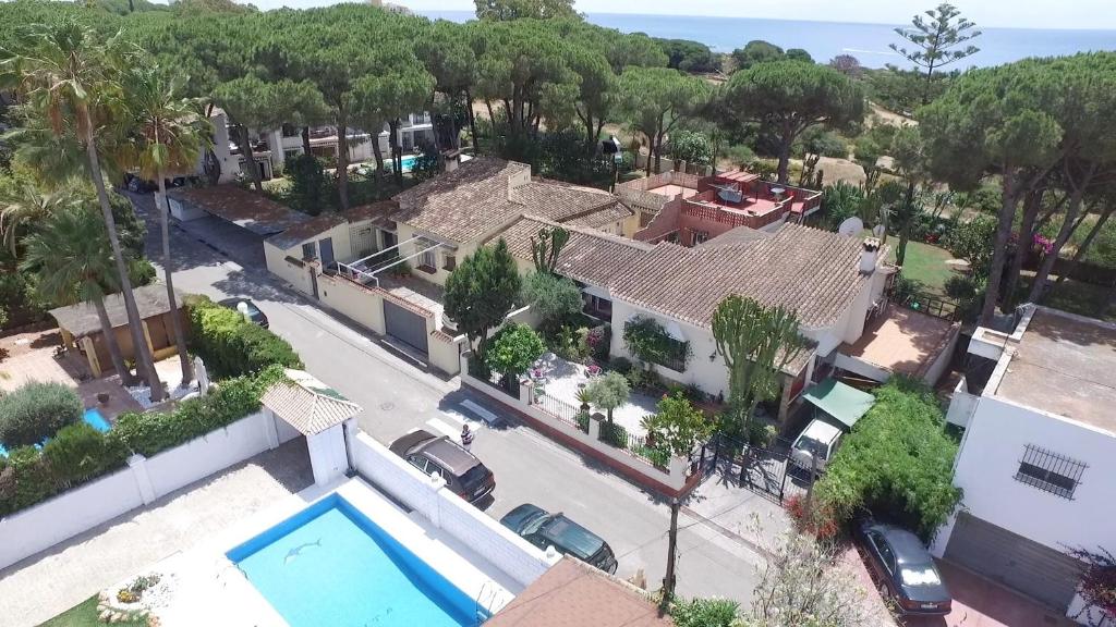 an aerial view of a house with a swimming pool at Garden Cottage at Casa Madden in Marbella