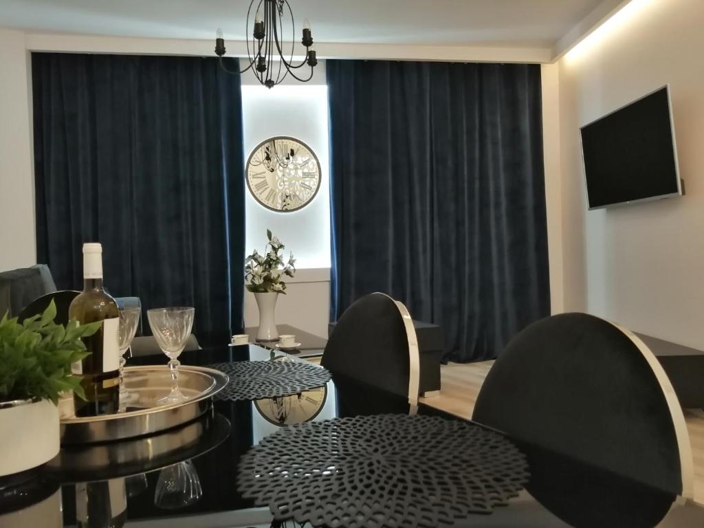 Televízia a/alebo spoločenská miestnosť v ubytovaní Time To Relax Apartment