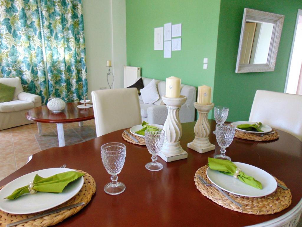 a dining room table with plates and glasses on it at Casa Verde in Perea