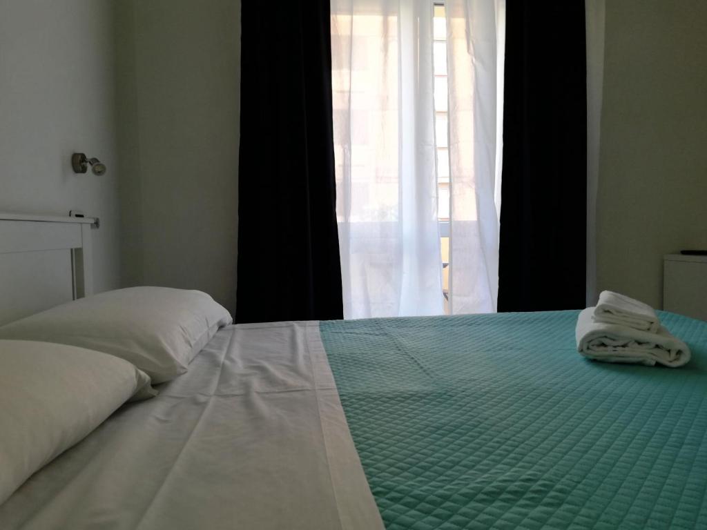 Posteľ alebo postele v izbe v ubytovaní DOMO ALGHERO CENTRO