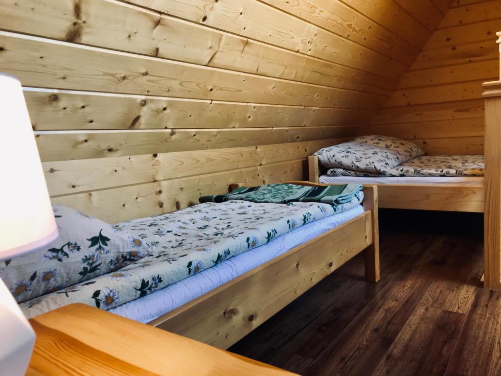 Posteľ alebo postele v izbe v ubytovaní Pokoje Gościnne U Jaśka