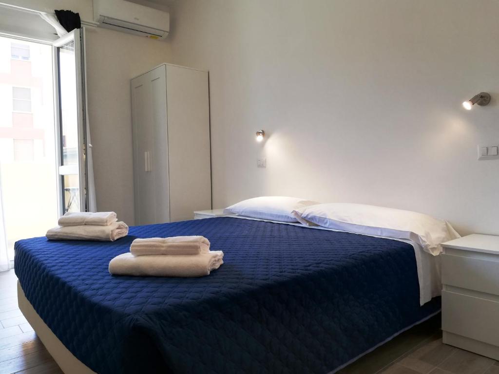 Posteľ alebo postele v izbe v ubytovaní DOMO ALGHERO CENTRO